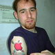 Image for article titled 12 Idiots With Hideous and Stupid Apple Tattoos